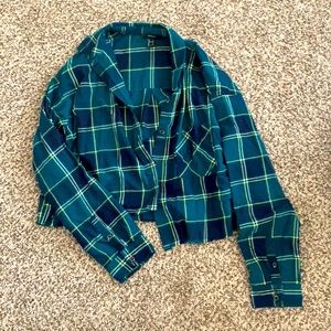 Green cropped flannel with yellow and white lines.